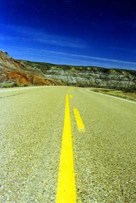 A road in the Bandlands in March. HooDoo Trail, 50km South of Drumheller, Alberta, Canada.