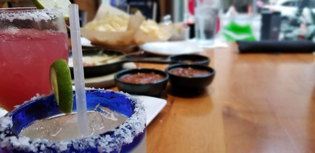 Pictured is a delicious TexMex meal, with salted margaritas in the extreme foreground. 