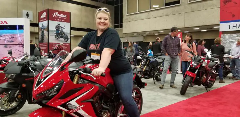 Carrie sitting astride the 2020 CB650R.