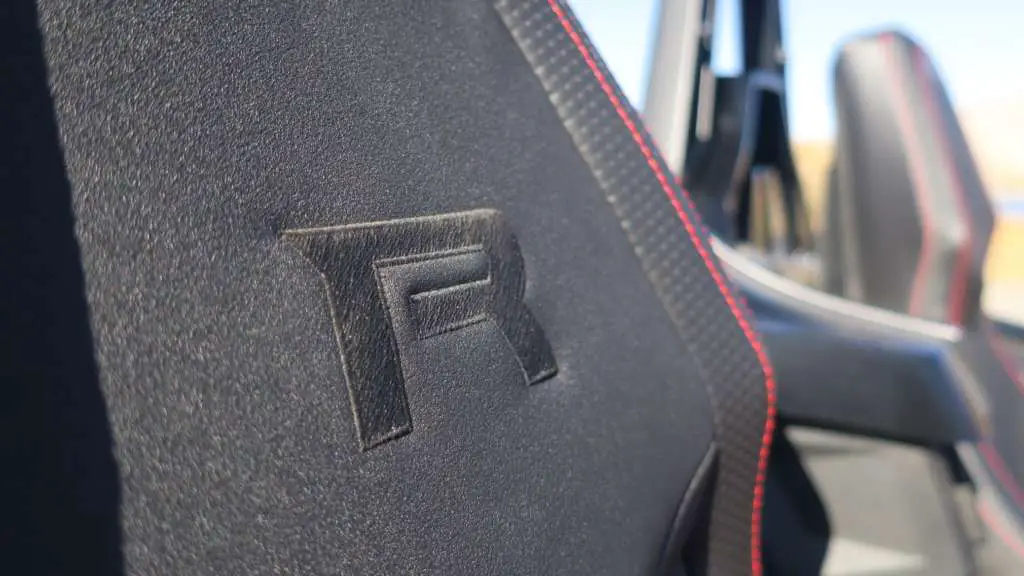 Close-up of the "R" logo embroidered on the seat of the Slingshot, showing the tight finish of of the stitching.