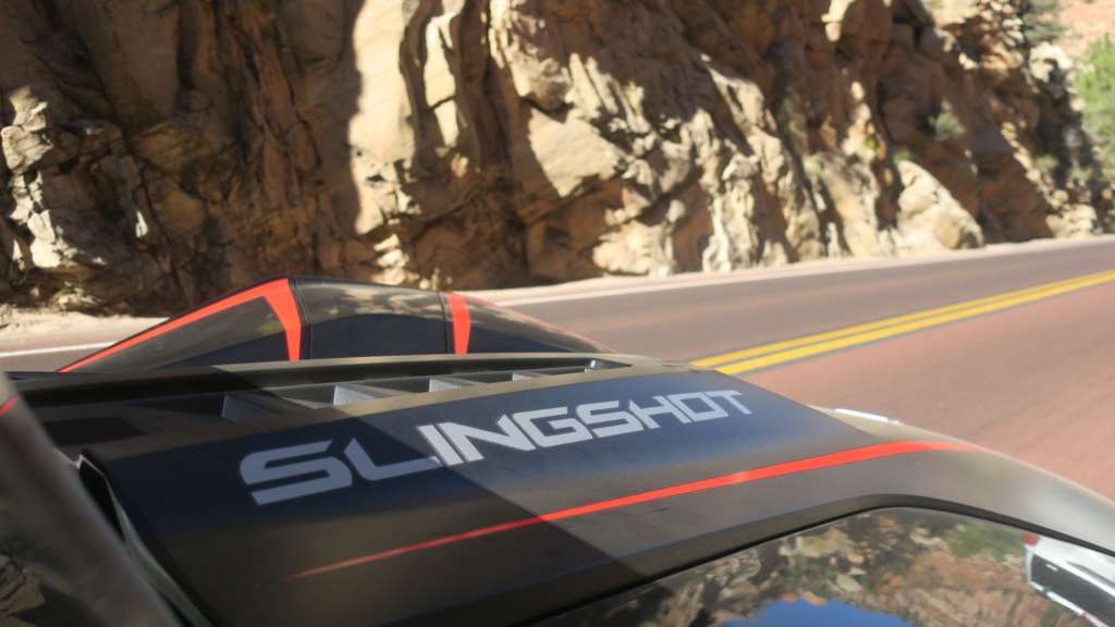 The hood of the Slingshot R from the passenger seat, from TMW's review. Highlighted is the bright silvered "Slingshot" text running down the hood, and the aggressive vents up the middle.