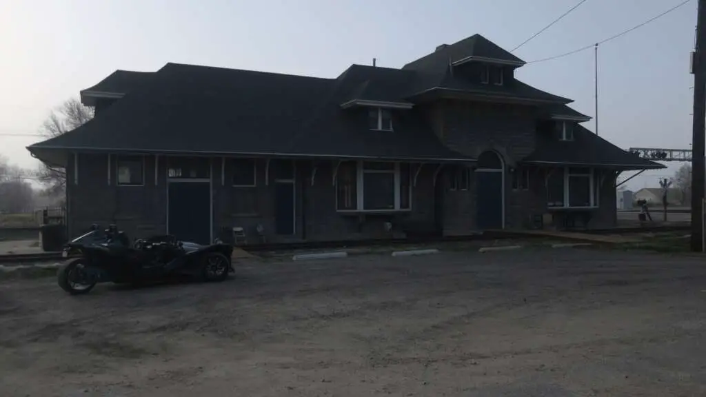 The Slingshot R pictured in the gravel parking lot of the Historic Brigham City Train Depot.